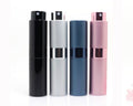 Compact refillable travel perfume atomizer with durable metal body and anodized aluminum nozzle in multiple colors