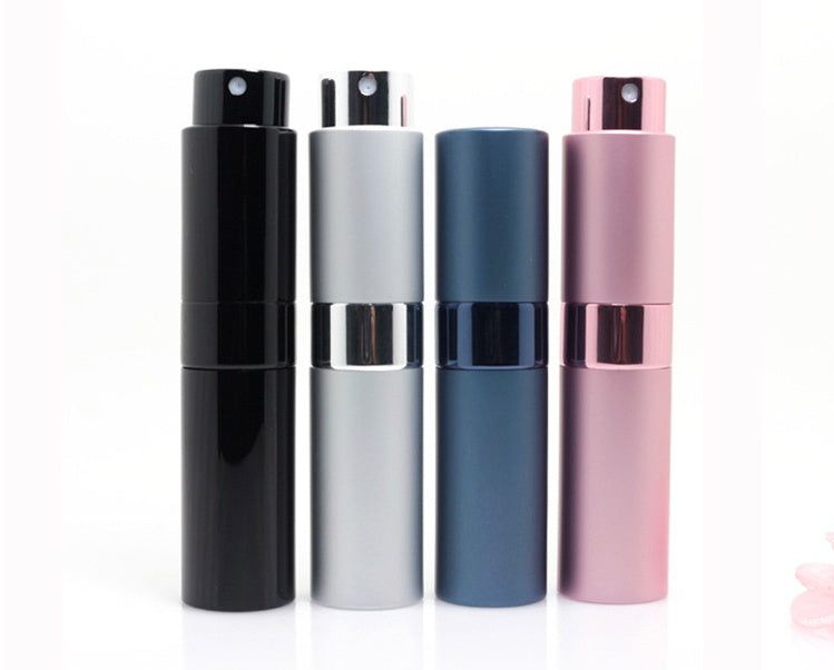 Compact refillable travel perfume atomizer with durable metal body and anodized aluminum nozzle in multiple colors